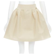 CHANEL light beige gold CC logo button flared skater skirt FR40 L Reference: TGAS/E00147 Brand: Chanel Designer: Karl Lagerfeld Material: Viscose, Blend Color: Cream, Gold Pattern: Solid Closure: Zip Lining: Beige Fabric Extra Details: Side zip. Gold CC resin button. Made in: Italy CONDITION: Condition: Excellent, this item was pre-owned and is in excellent condition. This piece was being kept in great condition and is ready to be loved. Comes with: Style code present (Generic) SIZING Designer s Boohoo Chic, Midi Skater Skirt, Blue Skater Skirt, Flared Skater Skirt, Zip Lining, Random Fashion, Mini Skater Skirt, Flared Mini Skirt, Handmade Skirts