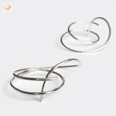 Edith Toledano | Sterling Silver Large Thick Hoop Studs, Gauged Hoops for 18g Piercings, Spiral Wire Earrings, Sculptural Statement Hoop Earrings, Ear Jackets | #SterlingSilverHoops #SterlingSilverHoopStuds #SterlingSilverHoopEarrings #HoopEarrings #HoopStuds #LargeHoops #ThickHoops #GaugedHoops #18GaugePiercings #SpiralEarrings #WireEarrings #SculpturalEarrings  #StatementEarrings #EarJackets #EdithToledano #Etsy Silversmith Jewellery, Statement Hoop Earrings, Ear Jacket Earring, Spiral Earrings, Earrings Ear, Sterling Silver Hoop Earrings, Wire Earrings, Sterling Silver Hoops, Long Earrings