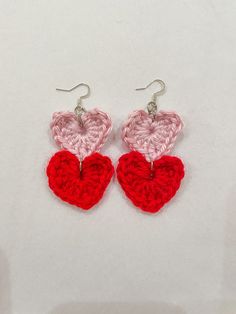 "These cute & flirty dangle heart earrings are the perfect accessory for Valentine's Day or a statement piece for everyday wear.  DETAILS: This item is handmade  Materials: Acrylic Yarn, iron ear hooks Size: approx. L 3\" x W 1.5\"  📦 Free Shipping on US orders of $35+ ❤️ If you have any questions, please feel free to send me a message ❤️ Follow us on Instagram & TikTok @tintin_designco for store updates and discounts PLEASE NOTE THAT DUE TO THE HANDMADE NATURE OF THESE ITEMS, WE DO NOT ACCEPT RETURNS. HOWEVER, IF THERE IS A PROBLEM WITH YOUR ORDER, PLEASE MESSAGE ME." Handmade Cute Double Heart Earrings, Handmade Double Heart Cute Earrings, Trendy Dangle Heart Earrings For Valentine's Day, Trendy Handmade Dangle Heart Earrings, Cute Dangle Earrings For Valentine's Day, Handmade Double Heart Earrings, Cute Style, Handmade Drop Earrings For Valentine's Day, Cute Double Heart Charm Earrings, Trendy Red Double Heart Earrings