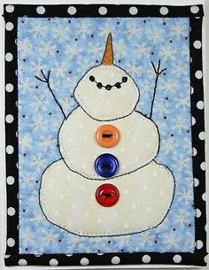 a snowman made with buttons on a blue background