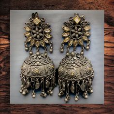 The Garni Oxidized earrings features an intricate design on Oxidized Silver with Kundan. This lightweight beauty is a perfect add to your collection Specifications Materials used: Oxidizes Silver, Kundan At Romikas, we pride ourselves on the craftsmanship and high quality of our jewelry, designed to enhance your natural beauty. Please contact us with any questions. Oxidized Earrings, Oxidized Silver, Intricate Design, Natural Beauty, High Quality, Silver, Beauty, Design