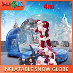 an inflatable snow globe with santa claus on it