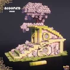 an image of a building made out of legos with flowers on top and trees in the middle