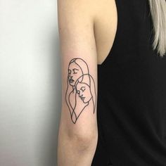 a woman's arm with a line drawing of two women on the left side of her arm