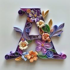 the letters are made out of paper and decorated with flowers