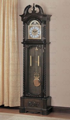 a grandfather clock sitting on top of a wooden shelf next to a window with drapes