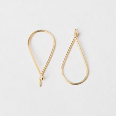 Minimalist, gold wire earrings that finish in a twist; the perfect balance of dainty and statement. Our affordable, demi-fine jewelry is designed in Vancouver, Canada and we focus on minimalist pieces that will go with any everyday look. The Twists were inspired by the ever-zany and always-fashionable Eva Chen. 10mm wide x 25mm long Gold vermeil: a thick layer of 14k yellow gold over 925 sterling silver Care: Keep away from moisture; remove your jewelry before exercising or showering. Clean by wiping gently with a cloth and tucking it away in its pouch when not in use. View our other styles at https://www.etsy.com/shop/BuoJewelry For a limited time, buy two or more items and receive 10% off your entire order with code SAVE10. Happy shopping! Dainty Yellow Gold Wrap Earrings With Ear Wire, 14k Gold Teardrop Hoop Earrings With Lever Back, Minimalist Yellow Gold Earrings With Ear Wire, Gold Teardrop Threader Earrings 14k, 14k Gold Filled Teardrop Threader Earrings, 14k Gold Drop Threader Earrings With Ear Wire, Gold Minimalist Teardrop Earrings With Lever Back, Yellow Gold Wrap Drop Earrings, 14k Gold Wrap Earrings Gift