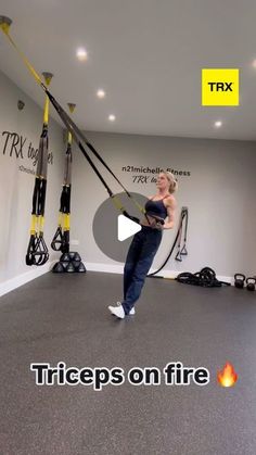 a woman is doing aerial exercises in an exercise room with the words triceps on fire