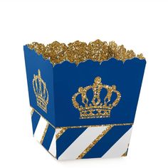 a blue and white striped box with gold glitter crown on the top, sitting in front of a white background