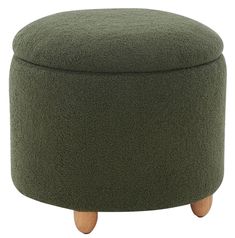 a green ottoman with wooden legs