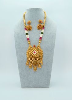 "Kundan Pendant Long Necklace Set/Antique Gold Pearl Necklace/Indian Necklace Set/Guttapusalu Necklace /Temple Jewelry/ South Indian Jewelry A premium quality AC Kundan pendant Necklace set with crystal & pearl beads comes with Jhumki earrings. This beautiful set is a graceful design for all Occasions.  Length of the Necklace: 12.5\" Earring Lenght Approx: 1.5\" Push-Back closure  Light-weight Micro Gold Plating on Brass base metal. Available in Stock. *Color may vary slightly due to light condition & photography. Jewelry Care:  Keep away from moisture. Allow perfumes and lotion to dry before wearing. Store in jewelry pouch. Clean only with soft lint-free cloth Categories we offer: American Diamond, CZ, Kundan, Pachi, Polki, Amrapali Inspired, Tyaani Kundan, German Silver, Contemporary Fus Ornate Temple Necklace For Festivals And Celebrations, Traditional Antique Gold Necklaces For Celebration, Antique Temple Necklace For Festivals And Celebrations, Temple Jewelry Mala With Latkans For Celebrations, Traditional Heavy Temple Necklace With Round Beads, Antique Gold Temple Necklace For Celebration, Antique Gold Temple Necklace For Festivals And Celebrations, Traditional Antique Gold Temple Necklace For Celebration, Ornate Heavy Temple Necklace For Celebrations