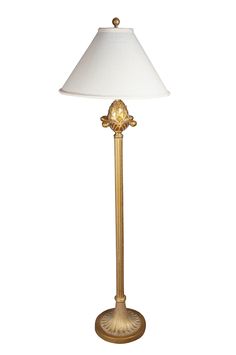 a gold lamp with a white shade on it