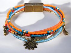 Introducing our stunning Autumn Sun Bracelet, beautifully designed with vibrant orange and blue beads. This eye-catching piece captures the essence of fall, combining colorful beads that harmonize perfectly. The soft orange suede adds a unique touch, making it both stylish and comfortable. Featuring a zamak metal magnetic clasp, this bracelet is as functional as it is fashionable! The rich colors symbolize warmth and transformation, embodying the spirit of autumn. Each bead is meticulously chosen to create a vibrant yet balanced design, bringing positivity and joy to your everyday style. This bracelet is a reminder of nature's beauty during this cozy season. Our bracelet comes in three standard sizes, ensuring a great fit for everyone. If you need a custom size, simply reach out to us, and Bohemian Orange Bracelet, Casual Orange Hand-strung Beaded Bracelets, Bohemian Orange Hand-strung Jewelry, Bohemian Orange Hand-strung Bracelets, Sun Bracelet, Bohemian Hand-strung Orange Beads, Autumn Sun, Soft Orange, Belly Chain