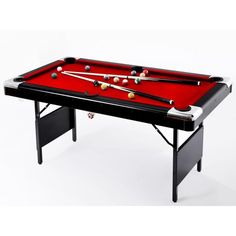 a red pool table with two cues and balls on the top, in front of a white background