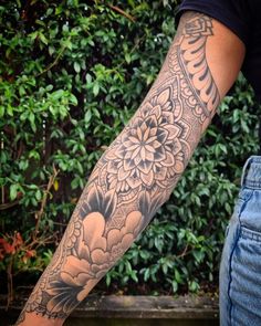 a person with a flower tattoo on their arm