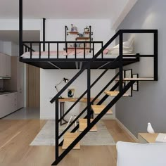 there is a loft bed in the middle of this living room with stairs leading up to it