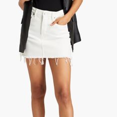 This Stylish Good American Mini Skirt Is Perfect For Any Casual Occasion. The Solid White Cotton Material With Denim Fabric Type And Button Accents Make It A Fashionable Addition To Any Wardrobe. The Skirt Features A Mid-Rise And Straight Pencil Style, With A Zip Closure For Added Convenience. It Has Pockets And Is Machine Washable, Making It Easy To Care For. This Skirt Is Great For The Spring And Summer Seasons, And Is Available In A Size 12 / 34 Jean Size. 15 In Good American Size Waist 37", White Denim Skirt With Frayed Hem For Spring, High Rise Cotton Mini Skirt For Day Out, Chic Cutoff Cotton Skirt, White Mini Skirt With Frayed Hem For Summer, White Frayed Hem Skirt For Spring, White Skirt With Frayed Hem For Spring, White High Rise Mini Skirt For Spring, Chic High Waist Skort With Frayed Hem, White Cotton Skort For Fall