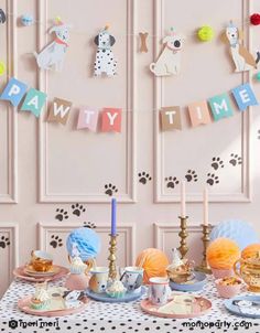 a dog themed birthday party with decorations and food