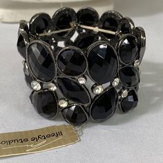 This Beautiful Stretch Bracelet Is Full Of Different Sizes And Shapes Of Black Faceted Stones With Clear Rhinestones Scattered Throughout The Bracelet. New And Never Worn. See Pictures For Details Ask Any Questions Bundle For Extra Savings Happy Poshing Elegant Crystal Stretch Bracelet, Adjustable Crystal Bracelet For Parties, Adjustable Crystal Bracelet For Party, Metal Crystal Bracelet With Stones For Party, Silver Bracelets With Stones For Party, Silver Bracelet With Stones For Party, Elegant Silver Stretch Bracelet With Bling, Silver Party Bracelet With Stones, Party Crystal Bracelet With Metal Stones