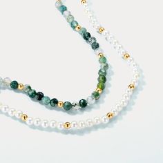 Embrace the mysterious beauty of nature with our Moss Green Pearl Beaded Necklace! The bracelet showcases alternating pearls and moss green stones, creating a balanced and visually appealing design. These stones are celebrated for their ability to bring a sense of tranquility and balance, making this bracelet not only a beautiful accessory but also a symbol of inner peace and harmony. Discover the perfect accessory to enhance your beauty and bring a touch of serenity to your style with our Moss Green Pearl Necklace With Natural Stones, Green Pearl Necklaces With Round Beads, Green Pearl Beaded Necklace With Natural Stones, Green Beaded Necklaces With Pearls And Natural Stones, Green Necklaces With Pearl Charm And Round Beads, Green Pearl Necklace With Polished Beads, Green Pearl Round Beads Jewelry, Green Moss Agate Round Bead Necklaces, Green Moss Agate Round Bead Necklace