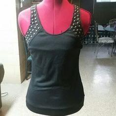 This Beautiful Black Studded Shirt Is Great Paired With Any Bottom. It's Full Of Detail. You Can Lace It Up In The Back Make It Loose Or Tight. Bronze/Gold Studs Makes It Very Edgy! Edgy Cotton Party Top, Punk Stretch Tops For Night Out, Punk Style Stretch Tops For Night Out, Edgy Cotton Tank Top For Night Out, Punk Style Cotton Party Tops, Edgy Cotton Top For Night Out, Black Fitted Rebellious Tops, Black And Gold Shirt, Studded Shirt