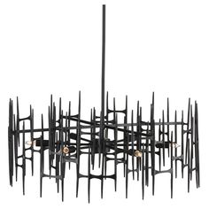 a chandelier made out of black metal rods