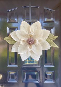 a door with a large white flower on it