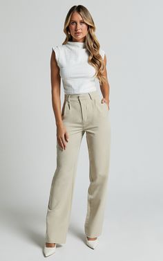 Get ready to elevate your workwear game with the Brionne Top. This high-neck, cap-sleeve top in classic white is a must-have addition to your fashion tops collection. Made from 100% polyester, it offers a sleek and stylish look that meets the highest standards of style and comfort. Whether you're heading to the office or meeting up with friends after work, this versatile top is perfect for any occasion. Pair it with tailored pants or a chic skirt for an effortlessly polished look that will make Beige Corporate Attire, White Top Outfit Work, Business Casual Wardrobe Essentials, White Top Work Outfit, Two Piece Work Outfit, Business Casual Sorority, Corperate Outfits Women, Female Minister Attire, Professional Hospital Work Outfit