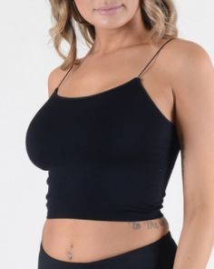 Fit | Feel | Stretch: Reg: fits sizes XS to Large (fitted) | Lightweight Nylon | Very Stretchy.Length 11" Recommended for sizes 0 to 14 - Chest size 32"-38"Material: 92% Nylon & 8% Spandex Get ready to rock any outfit with our One Size Cropped Tank Top! Available in 9 vibrant colors, this versatile tank is the perfect base layer for any look. Its cropped design allows for easy layering and it's so comfortable, you'll forget you're wearing it. (Seriously, we wear these under everything!) Faith | Fitted Solid Color Workout Tops, Fitted Black Solid Color Tank Top, Basic Fitted Black Tank Top, Basic Fitted Sports Crop Top, Denim Hoodie, Swim Skirt, Kimono Dress, Romper Dress, Denim Overalls