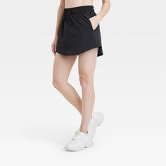 Why we're ALL IN: Woven mid-rise skort with built-in shorts in a regular-fit silhouette makes a cool choice for your active days. Moisture-wicking, quick-dry lightweight fabric helps you stay cool, while a drawcord elastic waistband provides a snug fit. Side pocket provides hands-free convenience and the UPF 50+ rating offers sun protection. All in Motion™: Made for every move, priced for every day. Casual Athletic Shorts With 5-inch Inseam For Sports, Casual Gym Shorts With 5-inch Inseam, Casual Short Tennis Skirt With Built-in Shorts, Casual Athletic Shorts For Workout With 5-inch Inseam, Casual 5-inch Inseam Athletic Shorts For Sports, Casual 5-inch Inseam Gym Shorts, Casual Athletic Shorts With 5-inch Inseam For Workout, Casual Sports Activewear Shorts, Spring Athletic Shorts With Moisture-wicking Mid-thigh Length