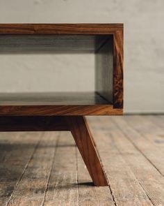 a wooden shelf sitting on top of a hard wood floor