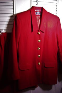 "Vinci designed this stunning red skirt suit, all wool, gold buttons, fully lined lipstick red suit!  Bust measures 38\", length 30\". Waist on skirt 30\", hip area 38\", length 24\".  Side pockets on the skirt.  No flaws of any kind.  Apparently never worn.  Stored with TLC.  Comes from a smoke-free home." Tailored Red Skirt Suit For Office, Elegant Red Skirt Suit For Fall, Classic Red Skirt Suit For Work, Elegant Red Formal Skirt Suit, Fall Formal Red Skirt Suit, Vintage Red Skirt Suit For Formal Occasions, Star Suit, Lipstick Red, Red Suit