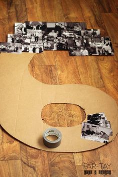 a piece of cardboard sitting on top of a wooden floor