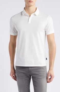 Classic and comfortable, this jersey polo made from soft cotton is always a great choice for everyday and keeps you looking as good as you feel. Button half placket Spread collar Short sleeves 100% cotton Dry clean Imported Classic White Cotton Polo Shirt, White Cotton Polo Shirt With Ribbed Collar, White Cotton Polo Shirt With Polo Collar, White Cotton Collared Polo Shirt, White Cotton T-shirt With Button Closure, White Polo Shirt With Johnny Collar, White Johnny Collar Polo Shirt, White Johnny Collar Polo Shirt With Placket, White Collared Polo Shirt With Button Closure