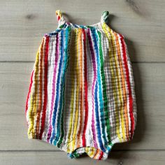 Primary Rainbow Striped Cotton Bubble Romper. Size 3-6 months. Snaps at diaper area. 100% cotton. Excellent used condition Sleeveless Cotton Onesie For The Beach, Sleeveless Cotton Onesie For Beach, Multicolor Cotton Onesie For Summer, Casual Multicolor Bubble Romper For Playtime, Cotton Bubble Romper For Beach, Playful Cotton Onesie For First Birthday, Playful Cotton Bubble Romper For Beach, Playful Multicolor Bubble Romper For The Beach, Playful Multicolor Onesie For The Beach