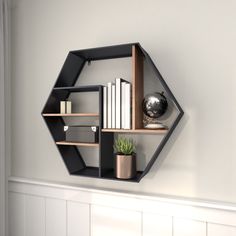 Organize and decorate in style with this geometric floating shelf that would easily complement your industrial-themed living room or office space. This item ships in 1 carton. Can be hung horizontally using the keyholes; nails and screws not included. Suitable for indoor use only. This item ships fully assembled in one piece. Maximum weight limit is 20 lbs. This is a single black colored floating shelf. Metal wall shelf features 5 shelves. Industrial style. Grayson Lane 29.5-in L x 6.75-in D x 2 Black Wall Shelf, Wall Shelf Black, Hexagon Wall Shelf, Pipe Bookshelf, Iron Pipe Shelves, Black Wall Shelves, Vintage Inspired Wall Decor, Shelves Industrial, Hexagon Wall