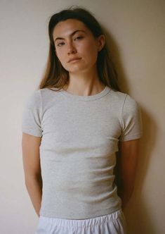 A fitted t-shirt from amsterdam-based flore flore with a lengthened short sleeve for an elegant and timeless look. this classic silhouette comes with round bindings and a double stitched cut-off seam on the back. made in the softest medium weight organic cotton baby rib.    fit | true to size take your normal size for a fitted look.    composition | 100% organic cotton    care | wash with like colours in cold water hang to dry.    made in portugal Fitted Cap Sleeve Top For Everyday, Classic Short Sleeve Top For Everyday Spring, Classic Fitted Cotton Short Sleeve Top, Fitted Cotton Classic Short Sleeve Top, Fitted Cotton Short Sleeve Classic Top, Classic Fitted Short Sleeve Cotton Top, Fitted Short Sleeve Crew Neck Top For Everyday, Fitted Crew Neck Short Sleeve Top, Fitted Crew Neck Short Sleeve Top For Everyday