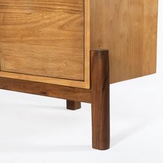 a close up of a wooden cabinet on a white background with no one around it