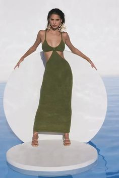 The Cult Gaia Serita is a cutout woven knit maxi dress. Thoughtful cutouts shape your figure, highlighting the small of your waist. A bra silhouette with a bare all open back. Pair with the Banu Bag and bare feet and you’re ready for a night of dancing on the beach. This dress is worth all the Instagram hype! | Designer Dress | Knit Maxi Dress | Cutout Maxi Dress | Resort Dress | Resort Outfit | Wedding Guest Dress | Sexy Maxi Dress | Designer Summer Outfit | Beach Wedding Guest Outfit | Summer Outfit Beach, Beach Wedding Guest, Designer Maxi Dress