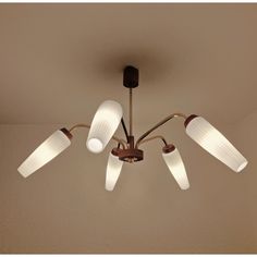 a ceiling light with five lights on it