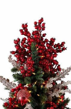 a christmas tree with red berries and lights