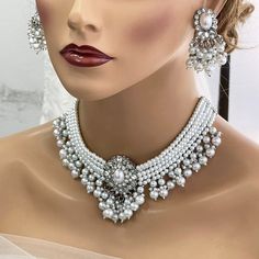 Bridal Set, Pearl Choker Necklace Earrings, Indian Bridal Jewelry Set, Kundan Jewelry, Victorian Pearl Choker statement, Bollywood Jewelry, evening jewelry set Gorgeous Glowing and sparkling luxury Bollywood-inspired jewelry set with studded diamonds and colorful stones, adding a royal touch to complete your look for your special occasion! It would be the perfect jewelry set for you chic brides and your bridesmaids, or any contemporary trendsetter looking for those traditional vibes, but still w White Jewelry Sets For Wedding, White Jewelry Sets With Matching Earrings For Wedding, White Dangle Wedding Necklace, Luxury Bridal Choker With Intricate Design, White Pearl Bridal Earrings For Celebration, White Dangle Bridal Necklace For Party, White Dangle Pearl Necklace For Wedding, White Necklaces With Matching Earrings For Wedding, White Necklace With Matching Earrings For Wedding