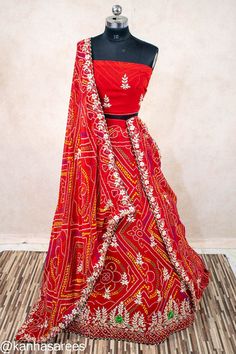 Bandhani Gotapatti Indian Wedding Lehenga Choli with Dupatta Immerse in the splendor of Indian heritage with this Bandhani Gotapatti Lehenga Skirt, a paragon of Rajasthani craftsmanship. Perfect for weddings and traditional ceremonies, this skirt is a celebration of culture and artistry. 🌹 Size can be customized also. This size fits upt  42 length and 42 waist.  When you place order please write length and waist size in customization box. So we will alter it and send to you. For further customization contact us in message inbox. Authentic Bandhani Design: Delicately tied and dyed by artisans, each pattern tells a story of heritage. Elegant Gotapatti Detailing: Embellished with the celebrated Rajasthani Gotapatti work for a regal touch. Perfect for Wedding Festivities: Be the belle of the Transitional Chanderi Lehenga With Gota Work, Diwali Fitted Pre-draped Saree With Motifs, Traditional Fitted Pre-draped Saree For Navratri, Floor-length Traditional Wear With Gota Work For Navratri, Floor-length Gota Work Traditional Wear For Navratri, Floor-length Gota Work Dress For Navratri, Transitional Floor-length Choli With Gota Work, Multicolor Motif Lehenga For Wedding, Multicolor Motifs Lehenga For Wedding