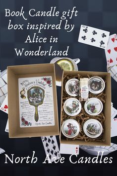 the book candle gift box inspired by alice in wonderland is open to reveal its contents