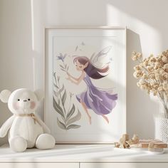 a white teddy bear sitting on top of a table next to a vase with flowers