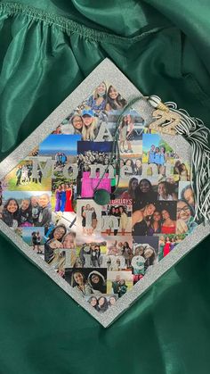 a green graduation cap with pictures of people on it and a tassel hanging from the side