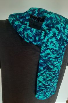 This crocheted scarf is a pretty navy and turquoise multicolor. Makes a plain ordinary scarf go from drab to fab!! It measures 7 inches wide by 54 inches long.   This scarf will be perfect on those cool or cold days to either wear as a fashion statement or to bundle up under your coat to keep warm. Buy it for yourself or as a gift. Since it's gender neutral it will work for anyone from a teen to a senior.  This item is machine washable and probably best to line or flat dry. Comes from a smoke fr Blue Bohemian Crochet Scarves, Crochet Scarves, Keep Warm, Cold Day, Scarf Wrap, Fashion Statement, Scarf Accessory, Fashion Accessories, Gender Neutral