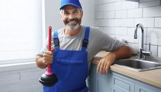 a man with a blue apron and hat holding a red handled tool in his hand