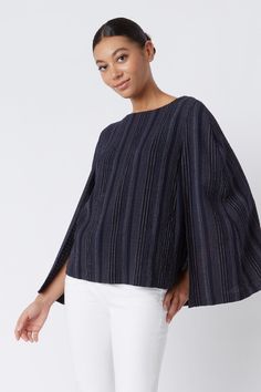 We took the concept from our best selling Cape Sweatshirt and made it into a new style just for you. Made in our variegated stripe gauze, this is sure to be your next favorite style. Pair it with any light color denim or trouser for an all year round look.THIS ITEM IS FINAL SALE. Boatneck shape with facing, cape back detail with longer length, clean hem finish. - 65% Polyester, 34% Viscose, 1% Spandex - Made in NYC - Professional dry clean or machine wash - Our model is 5'9" wearing size S - Che Minimalist Wardrobe Essentials, Cape Top, Capsule Wardrobe Pieces, Fall Workwear, Cape Tops, Professional Work Outfit, Minimalist Women, Business Casual Outfits For Women, Fashion Business Casual