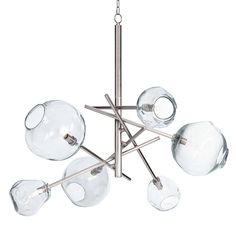 a chandelier with five clear glass globes hanging from it's ceiling